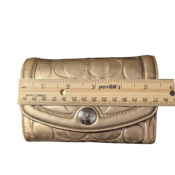 Metallic Gold Coach Embossed Trifold Wallet - Picture 14 of 16